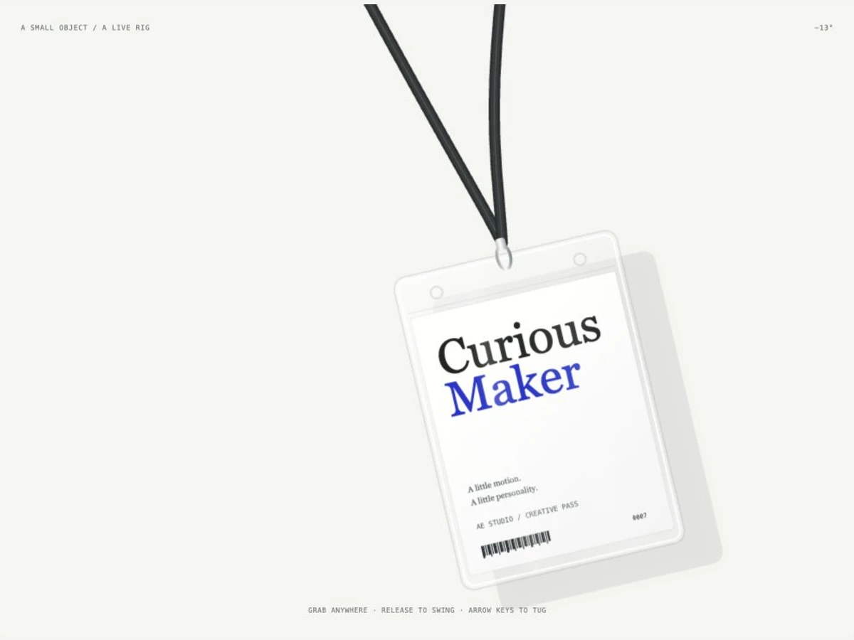 An original Curious Maker badge in a clear holder hanging from a dark lanyard